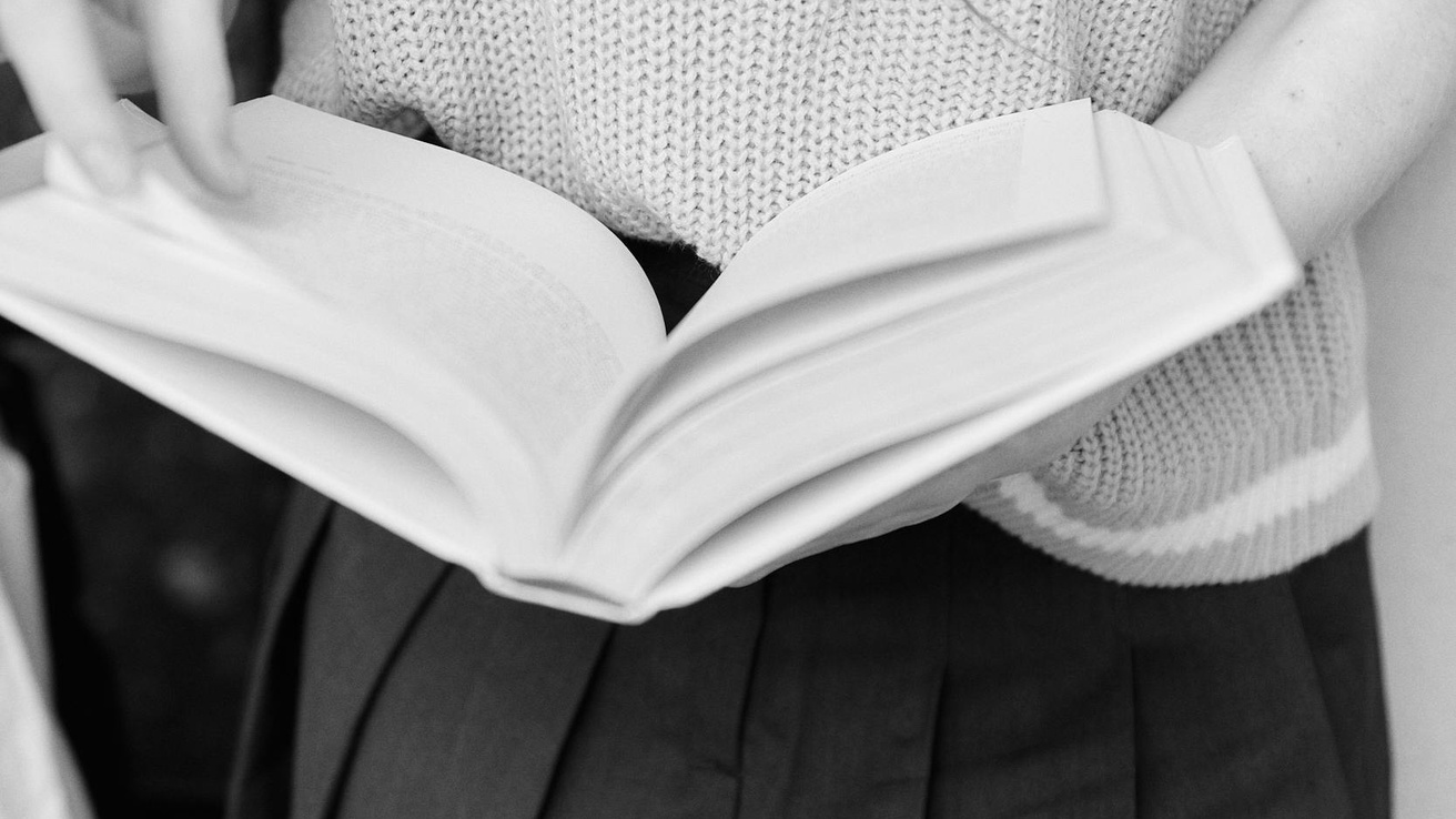 person holding an open book