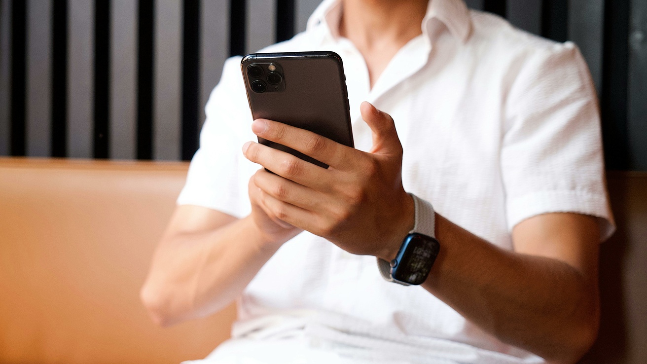 person holding a phone while looking at it